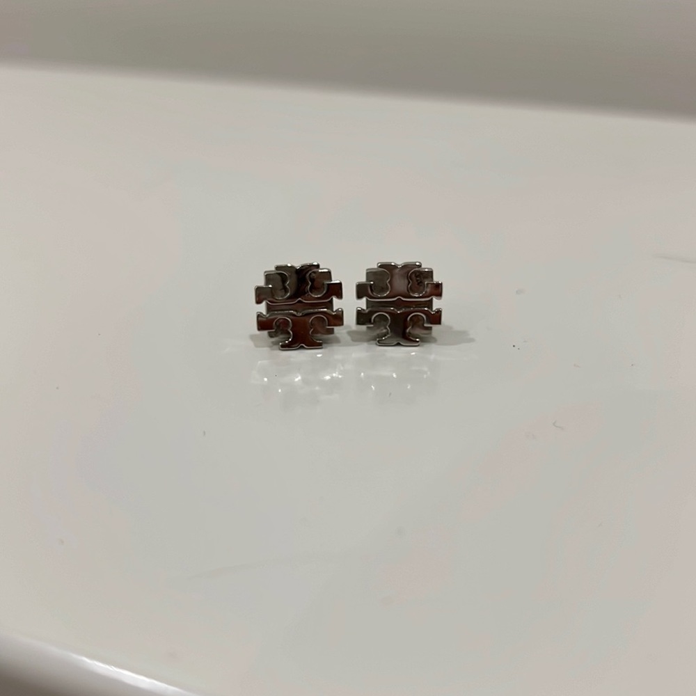 Silver Tory Burch pendant earring